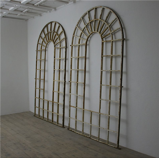 A large pair of C19th arched iron frames