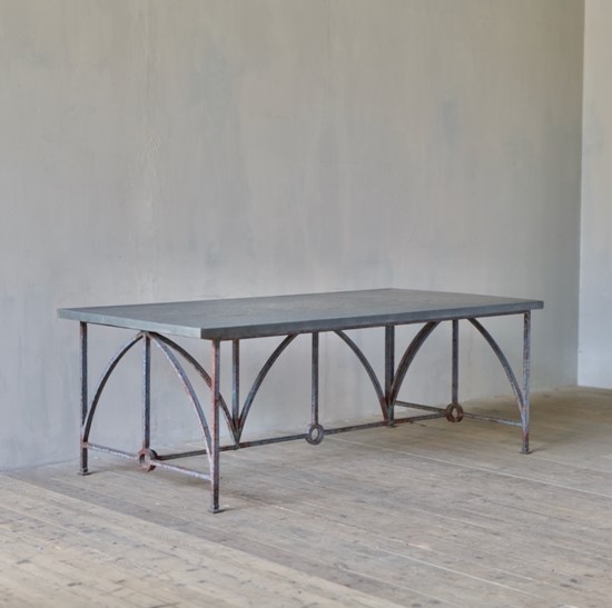An architectural iron and zinc dining table
