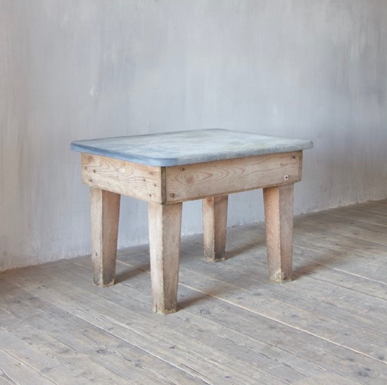 A primitive estate-made side table