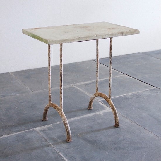 A 1920s side table with marble top