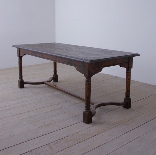 A heavily patinated oak table