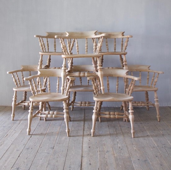 A set of 8 captain's chairs