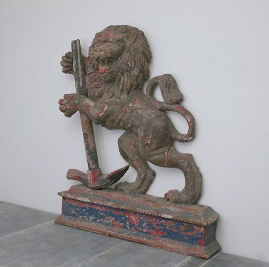 A C19th carved wood lion and anchor
