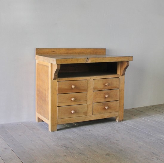 A primitive beech chest of drawers