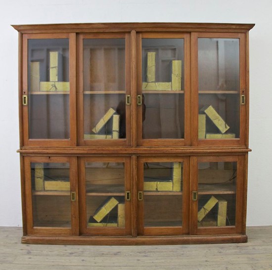 A C19th glazed pine cabinet