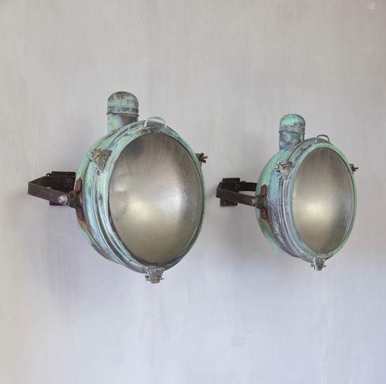 A 1920s pair of copper Holophane wall lights