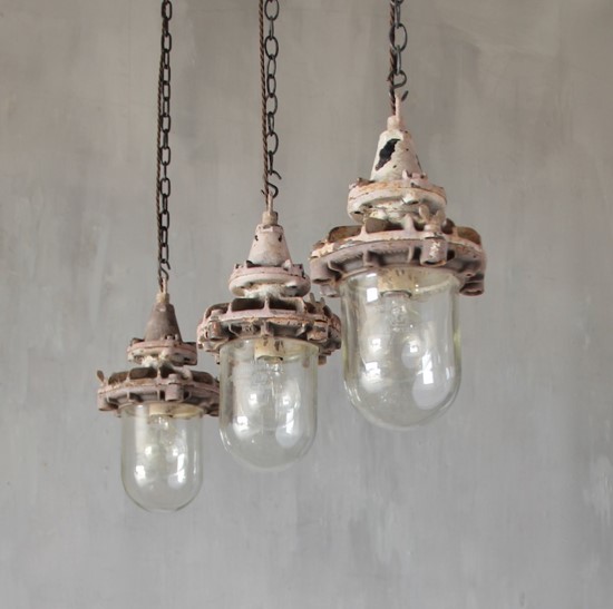 A set of three small industrial pendant lights