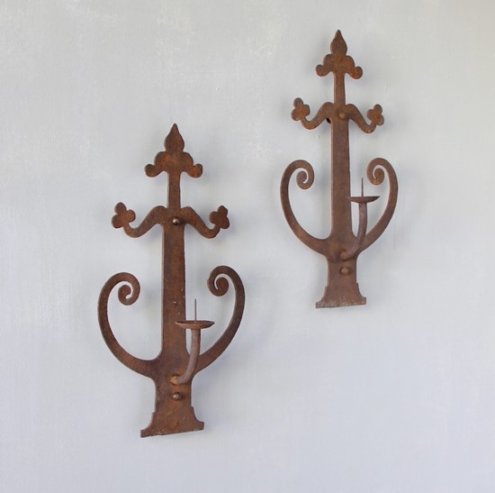 A pair of wrought iron sconces