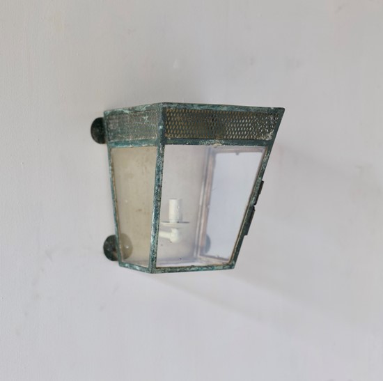 A simple estate-made wall lantern