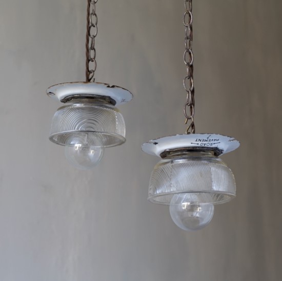 A pair of small glass pendant lights