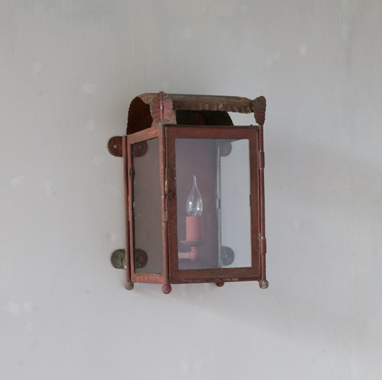 A primitive tole wall lantern