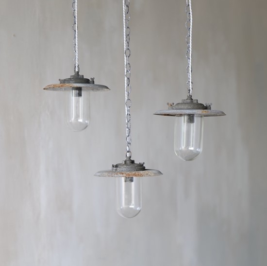 A set of three industrial pendant lights