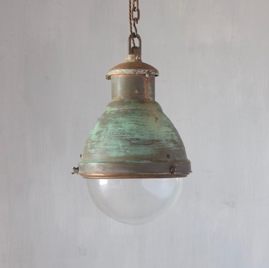 An industrial copper pendant light