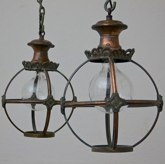 A pair of copper globe lanterns