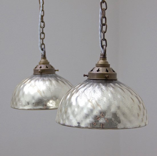 A pair of mercury glass pendant lights