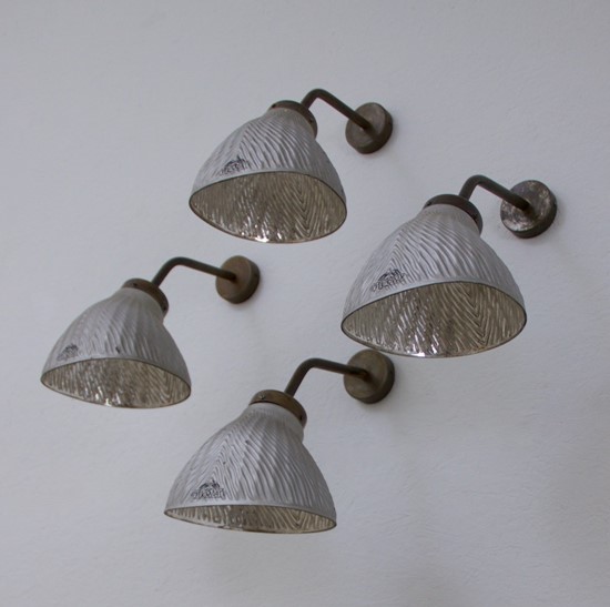 A set of 4 mirrored wall lights
