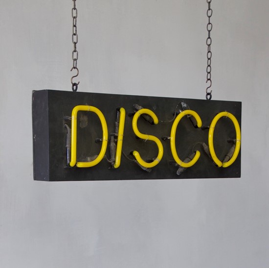 A 1980s neon disco sign
