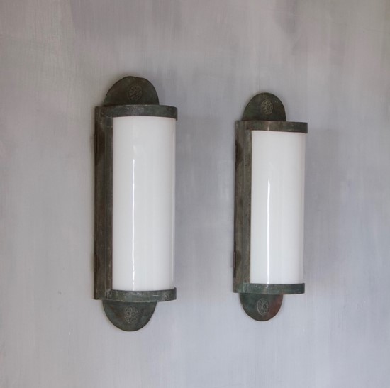 A pair of large bronze wall lanterns