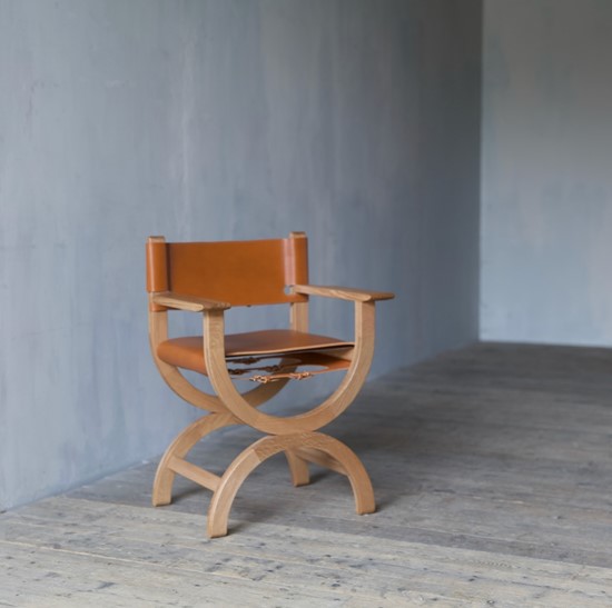 A set of bespoke x-frame chairs