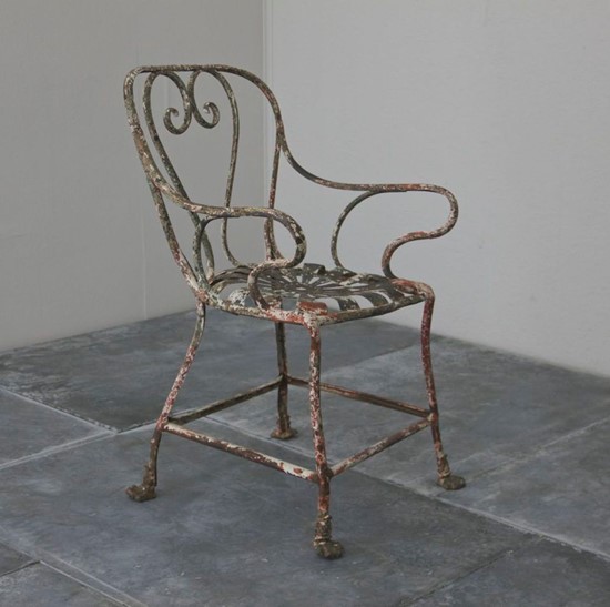 A c19th wrought iron 'arras' armchair  